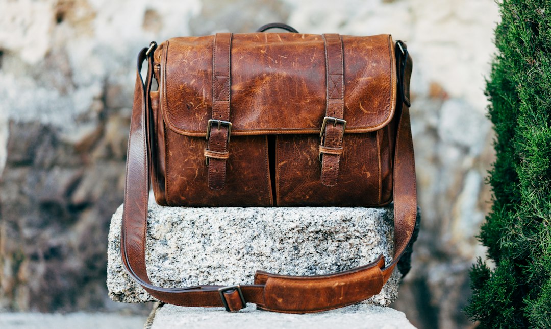 Brown leather bag on a concrete surface