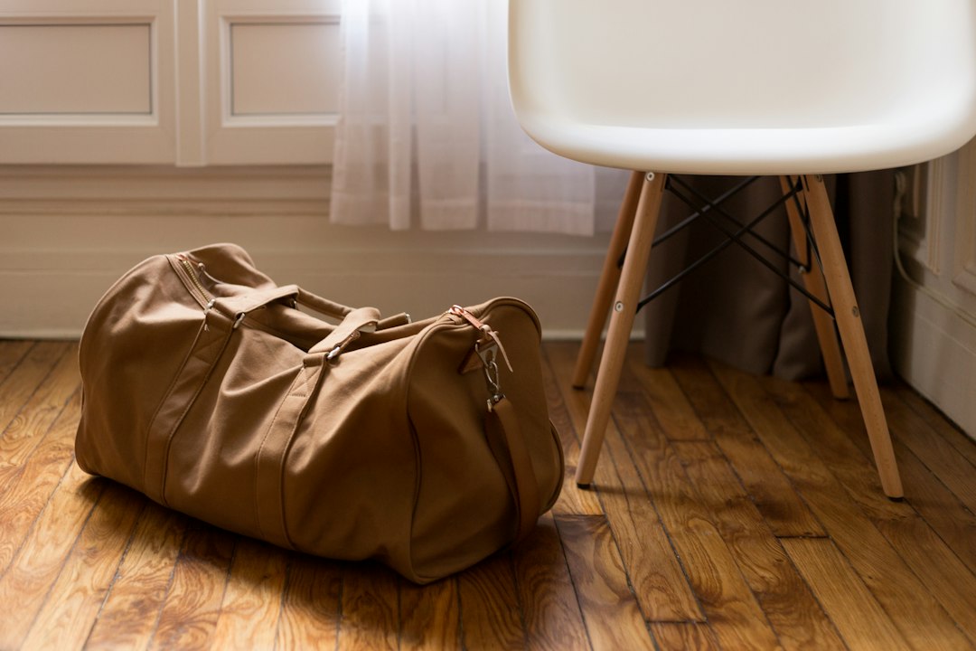 Sand-coloured leather and canvas duffel bag