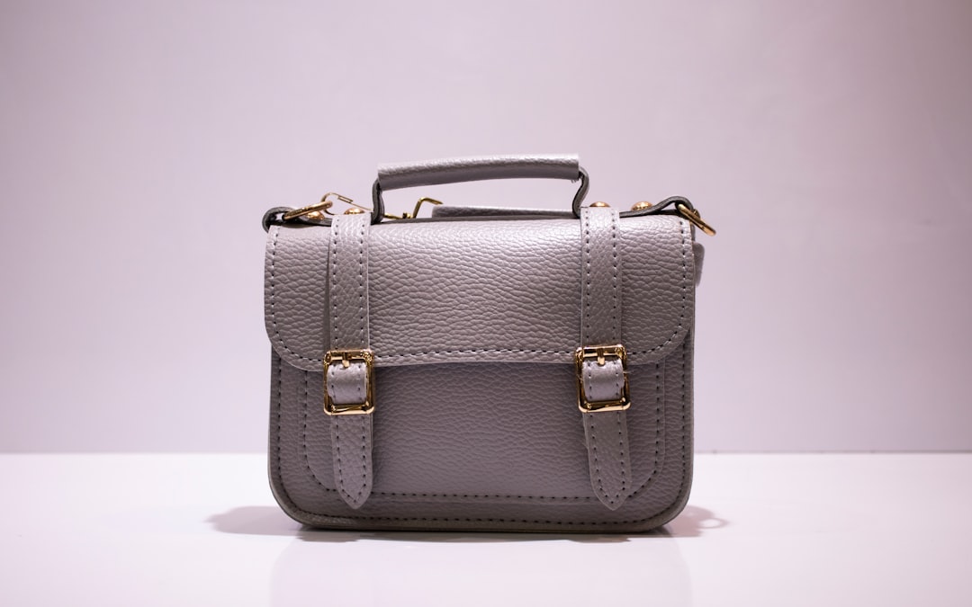 Grey leather satchel with gold buckles