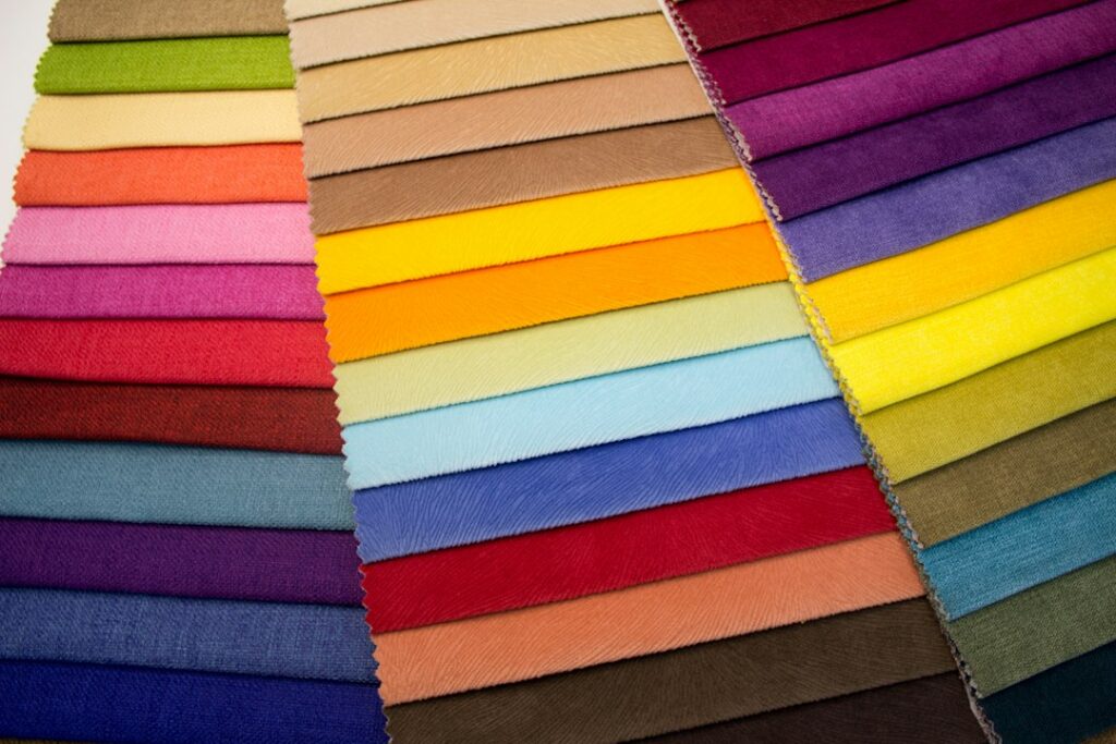 Multi-coloured striped textile on a wooden table