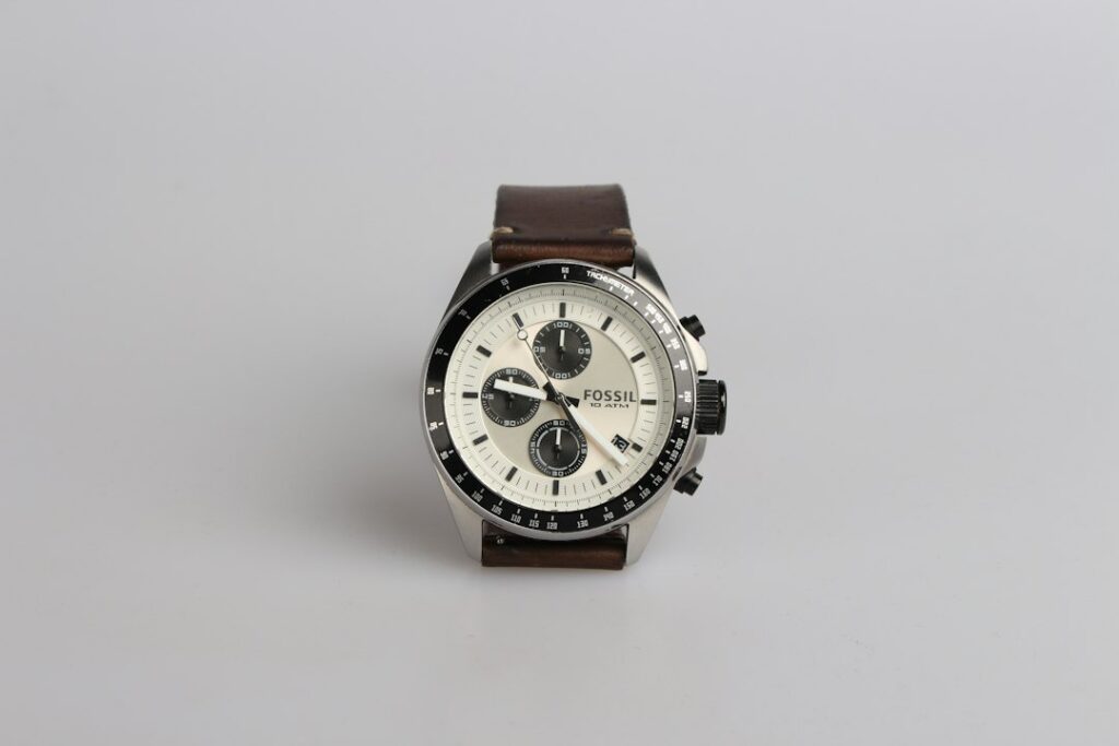 Silver chronograph watch with a brown leather band